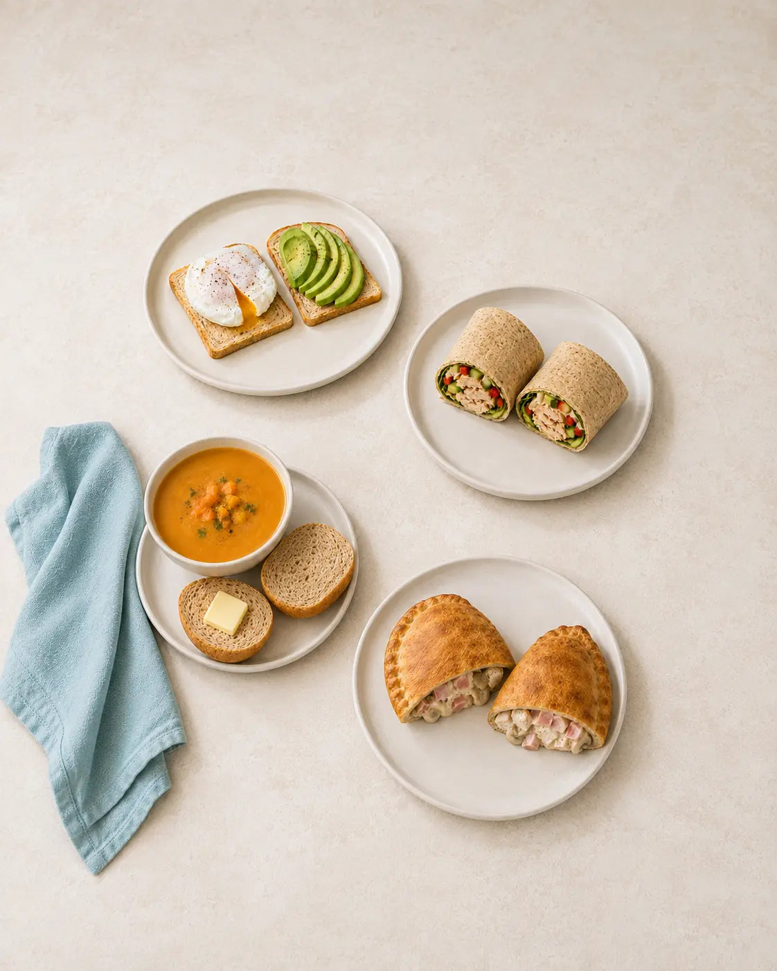 A selection of light high-protein SRSLY meals including toast, a wrap, a roll and a Pizza Bake